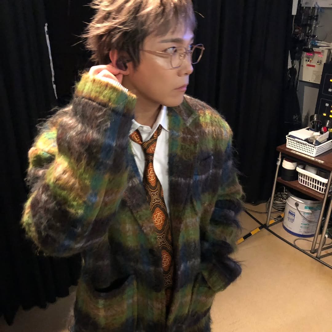 Photo by leehongki on December 24, 2025. May be an image of one or more people, bangs, duffle coat, bolo tie and text.