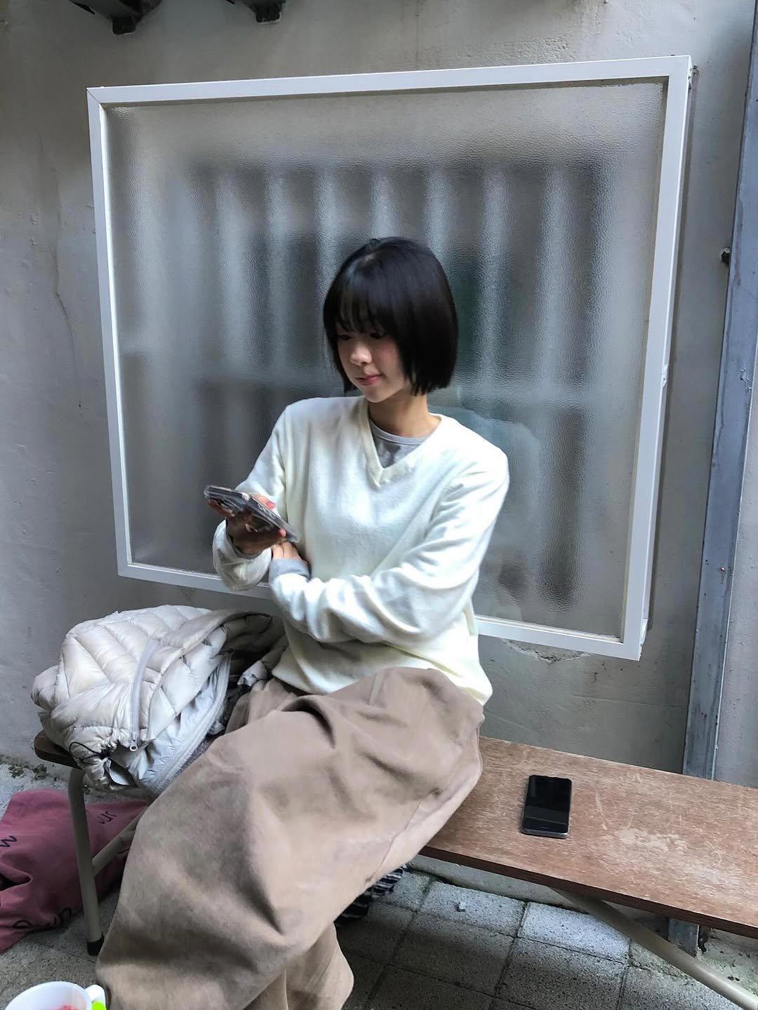 Photo by 진 / Jin on November 12, 2025. May be an image of duffle coat, clothes hanger, top, turtleneck, parka and text.