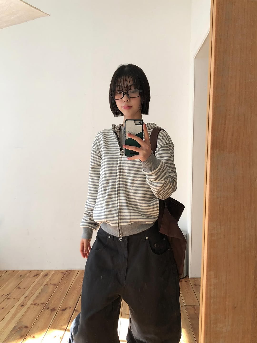 Photo by 진 / Jin on November 18, 2025. May be an image of duffle coat, sweatpants, turtleneck and text.