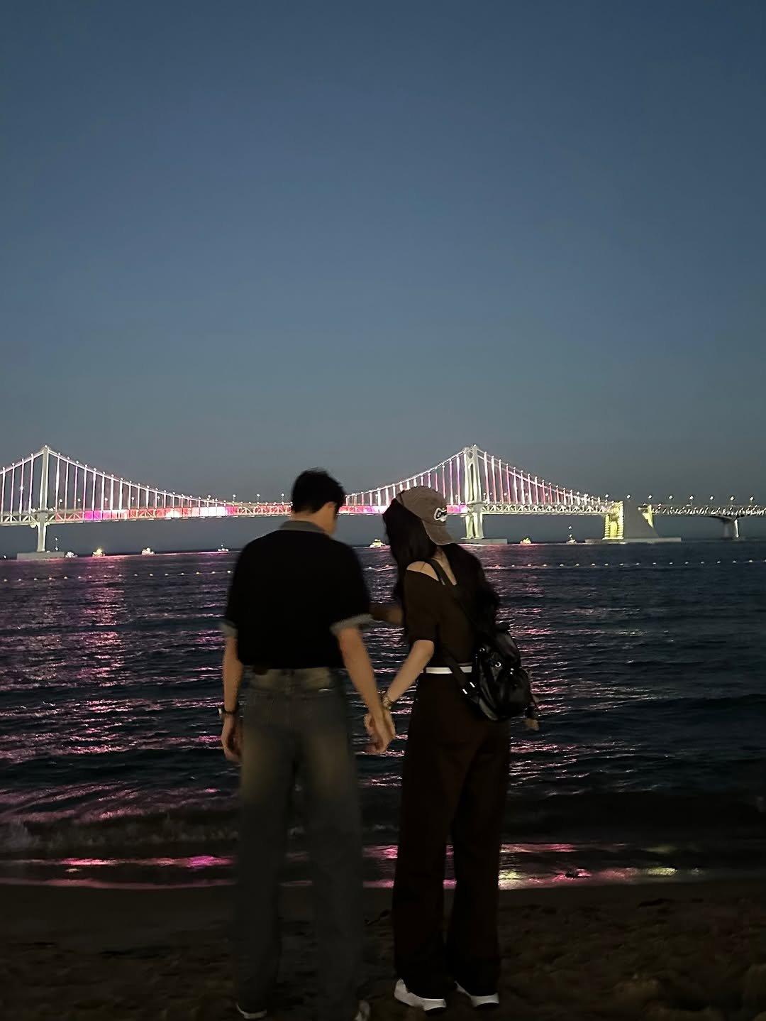 Photo shared by 송수빈 on June 29, 2025 tagging @_jun.w0n. May be an image of 2 people, people kissing, suspension bridge and text.