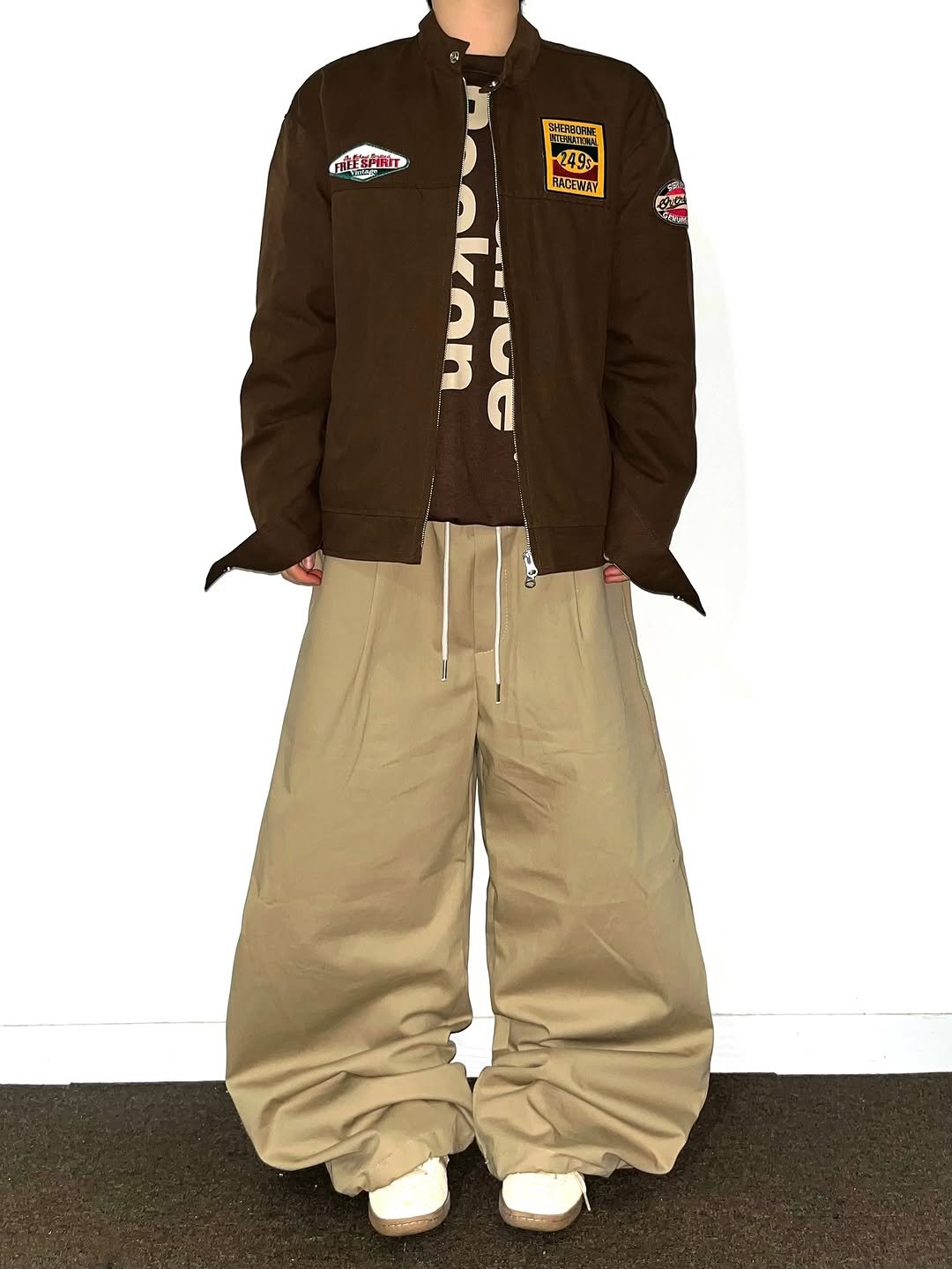 Photo shared by Chan / N’EST 네스트 on October 29, 2025 tagging @n_est.kr. May be an image of sweatpants, jacket, sweatsuit, parka, sportswear and text.