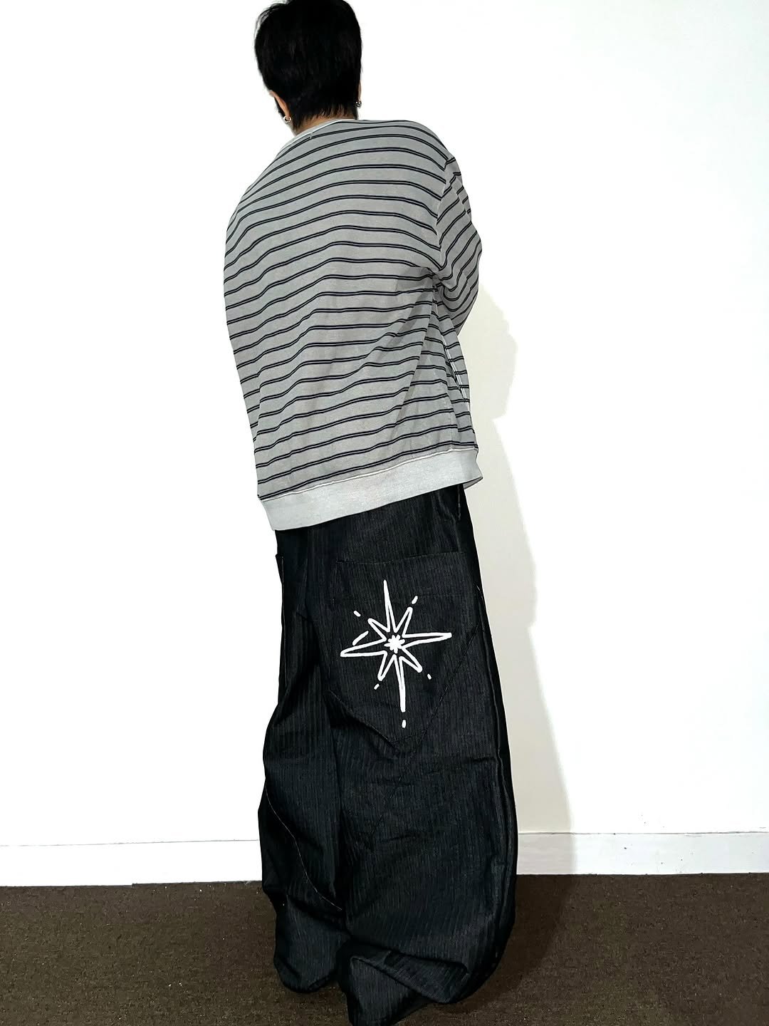 Photo shared by Chan / N’EST 네스트 on November 13, 2025 tagging @n_est.kr. May be an image of sarong, sweatpants and text.