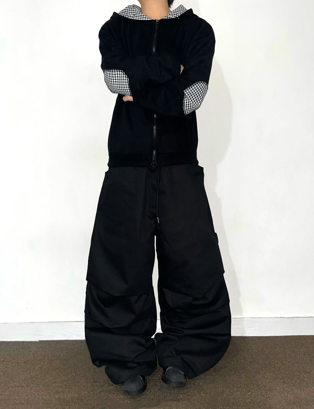 Photo shared by Chan / N’EST 네스트 on December 10, 2025 tagging @n_est.kr. May be an image of goosedown coat, jacket, sweatpants, face mask, snowsuit, sweatsuit, parka and text.