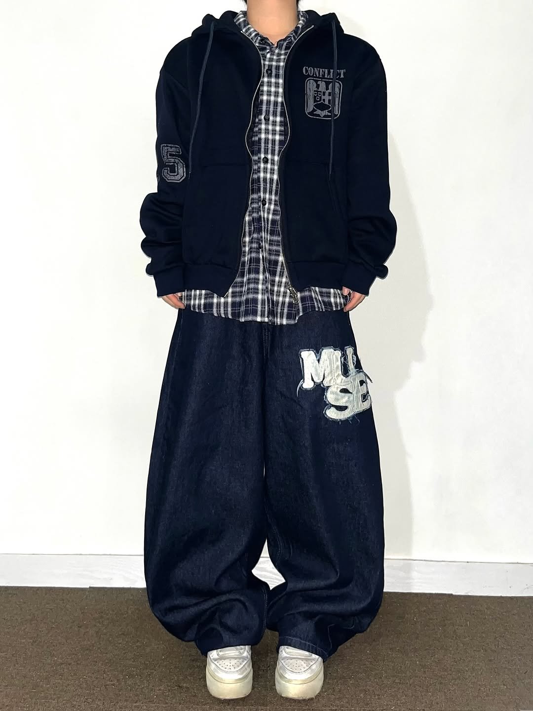 Photo by Chan / N’EST 네스트 on November 12, 2025. May be an image of sweatsuit, parka, sweatpants and text.