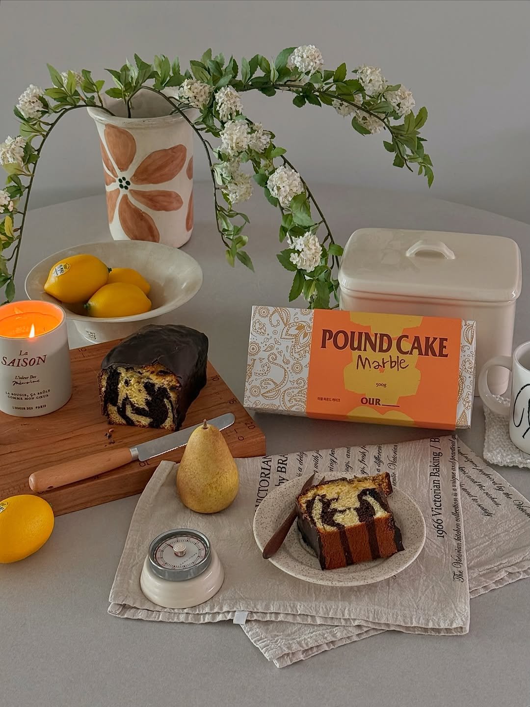 Photo shared by 소곤, 소곤테이블, 홈카페, 홈스타일링, 집꾸미기 on April 20, 2026 tagging @ourbakerycafe. May be an image of napkin ring, tablecloth, napkin, potholder and text that says 'SAISON AISON POUND POUNDCAKE CAKE Marble Laog 3 OUR TORIAN BRA'.