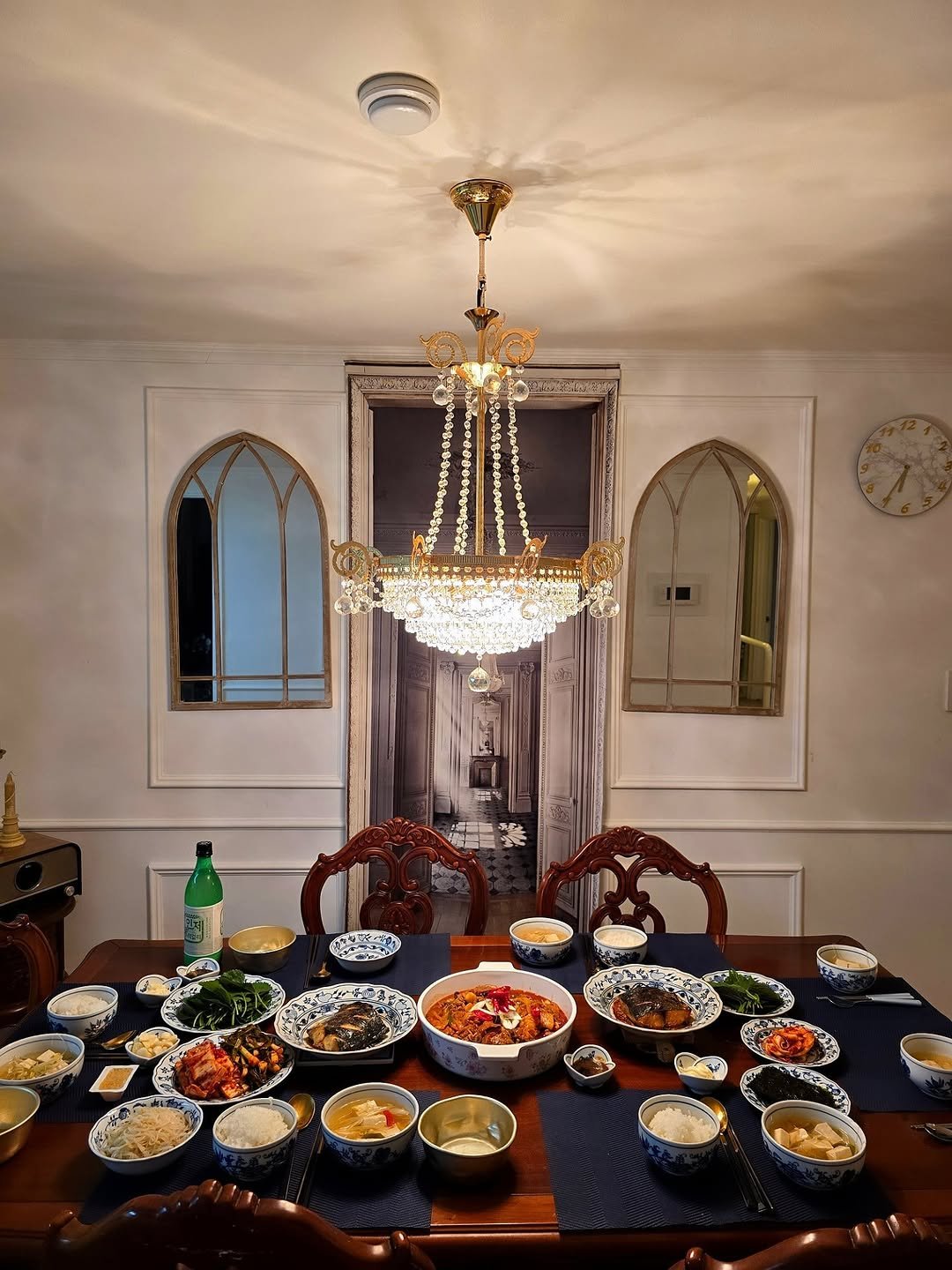 Photo shared by 안아맘 on November 11, 2025 tagging @kim_woo_joo. May be an image of candle holder, chinaware, chandelier, dining table and text.