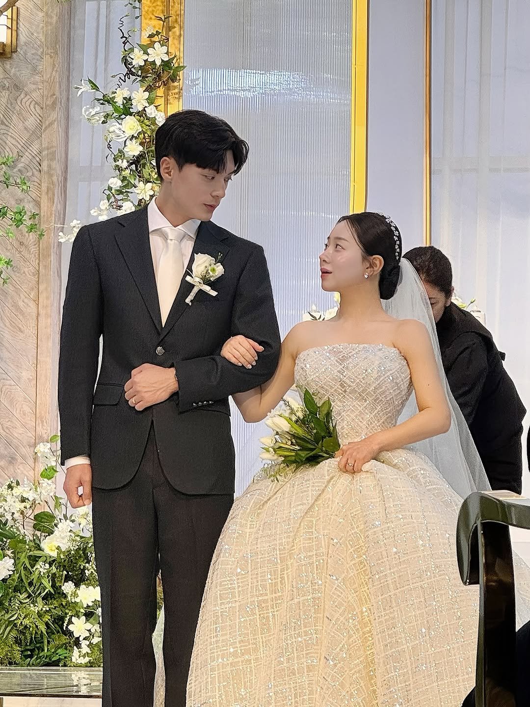 Photo shared by 백설기 on December 23, 2025 tagging @by.unseen. May be an image of dress, dinner jacket, gown, wedding and text.