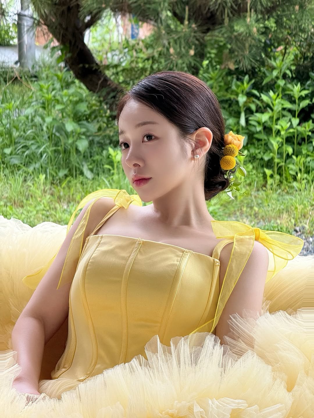Photo by 백설기 on September 23, 2025. May be an image of 1 person, braids, dress, gown and text.