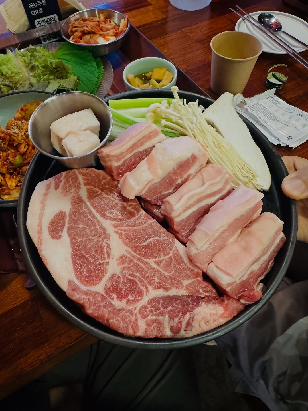 Photo shared by 백설기 on October 10, 2025 tagging @charcoal_farm. May be an image of hot pot, beef, pork and text.