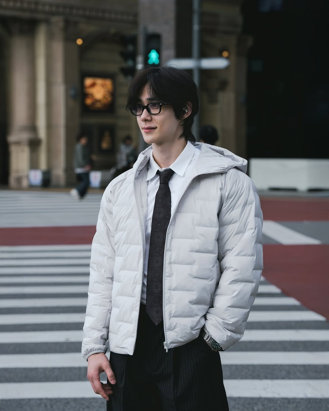 Photo shared by 박솔빈 on November 18, 2025 tagging @geongik. May be an image of duffle coat, overcoat, suit, street and text.