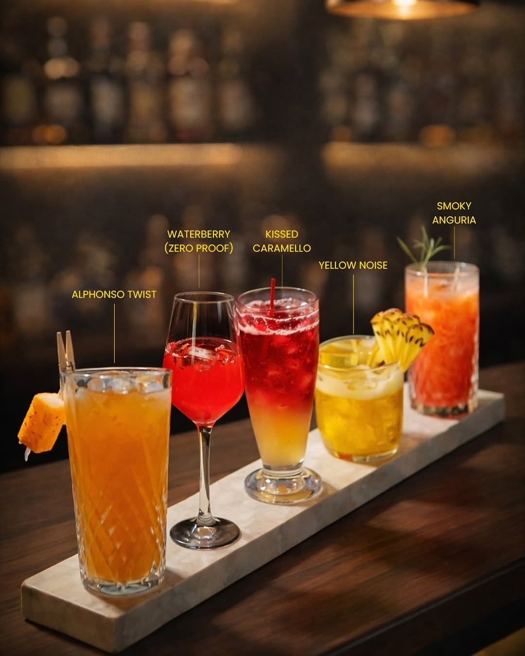 Photo by Someplace Else, Mumbai on April 27, 2026. May be an image of cocktail and text that says 'WA WATERBERRY (ZERO (ZEROPROOF) PROOF) SMOKY ANGURIA KISSED CARAMELLO YELLOWNOISE NOISE ALPHONSOTWIST ALPHONSO TWIST elin'.