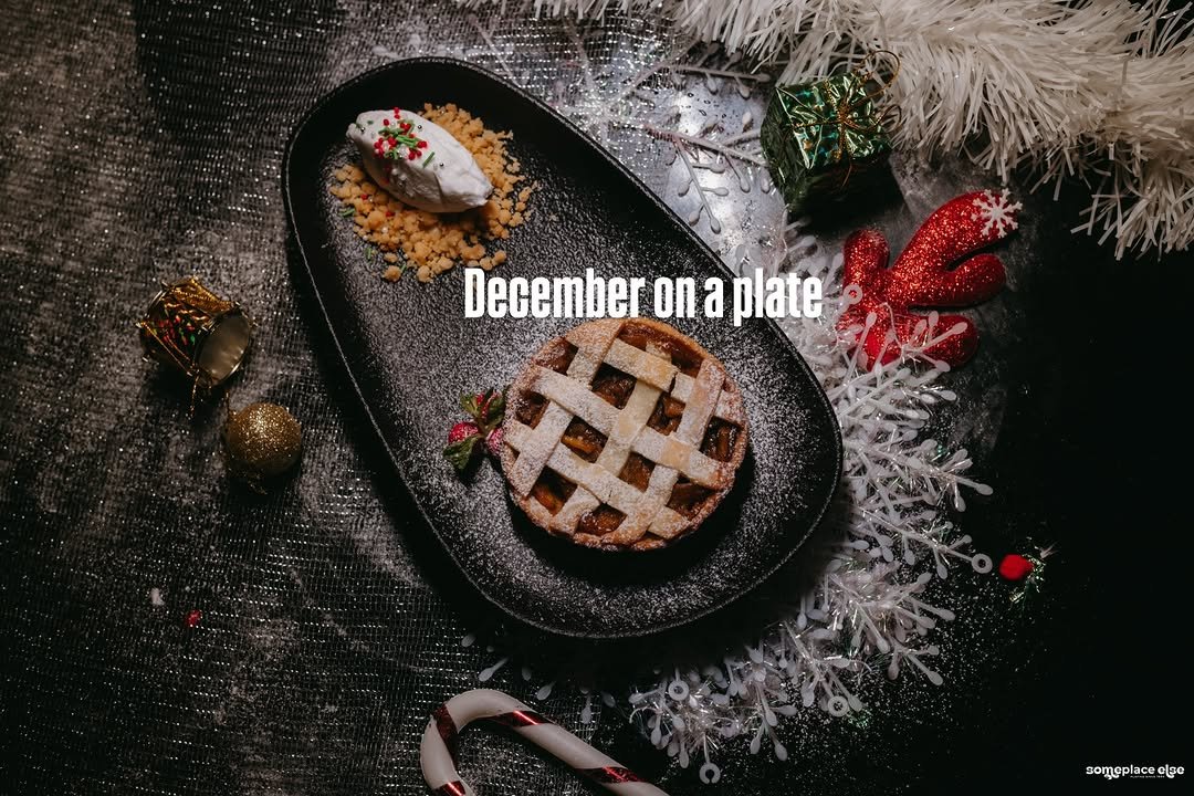 Photo by Someplace Else, Mumbai on December 28, 2025. May be an image of christmas tree, pie, tinsel and text that says 'December on a plate somoplac ace else'.