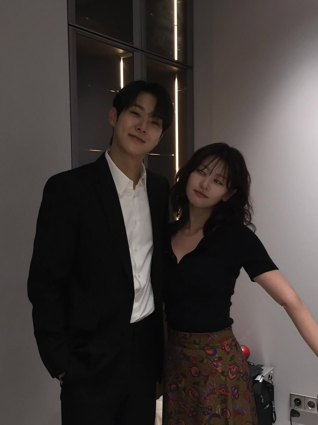 Photo by 정소민 on November 07, 2025. May be an image of one or more people, suit, bolo tie, dinner jacket and text.