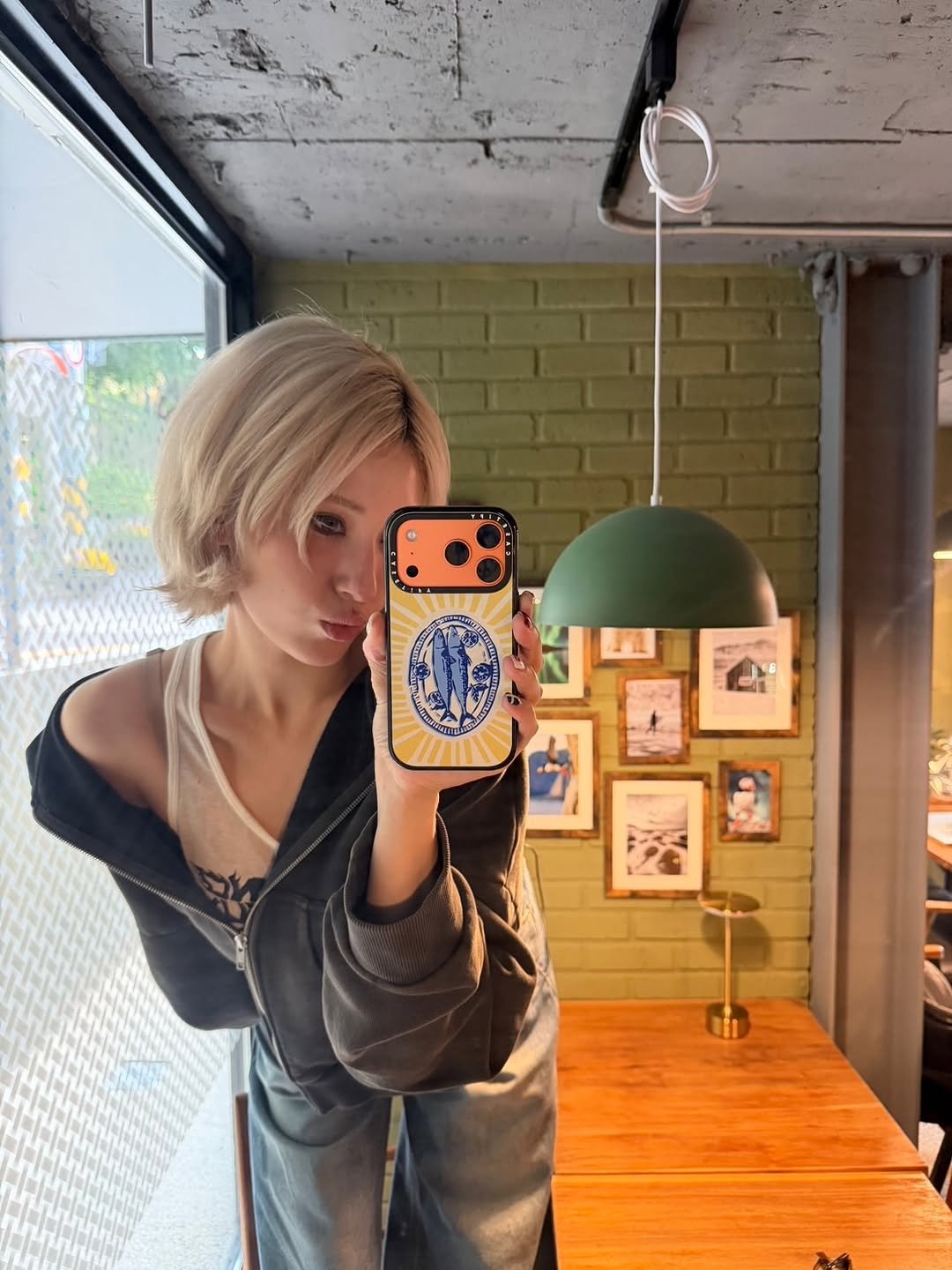 Photo by SOMI on October 24, 2025. May be a selfie of one or more people, blonde hair, phone, mirror, cornflower and text.