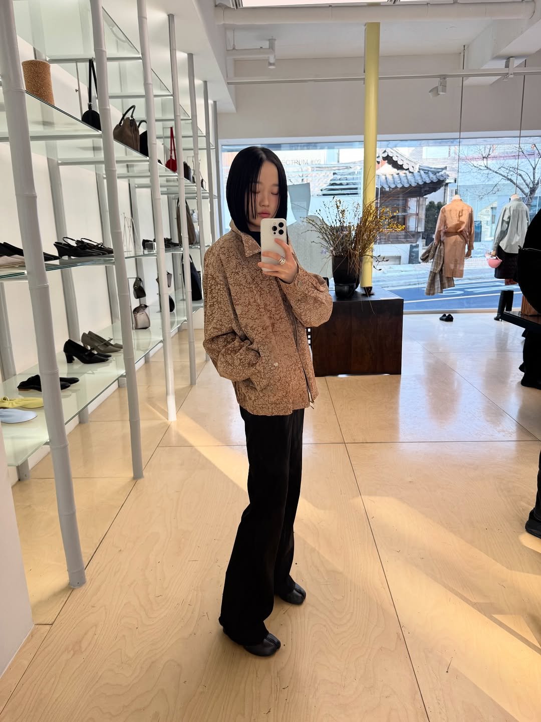 Photo shared by 아방 on January 14, 2026 tagging @umber_postpast. May be an image of duffle coat, overcoat, parka and text.