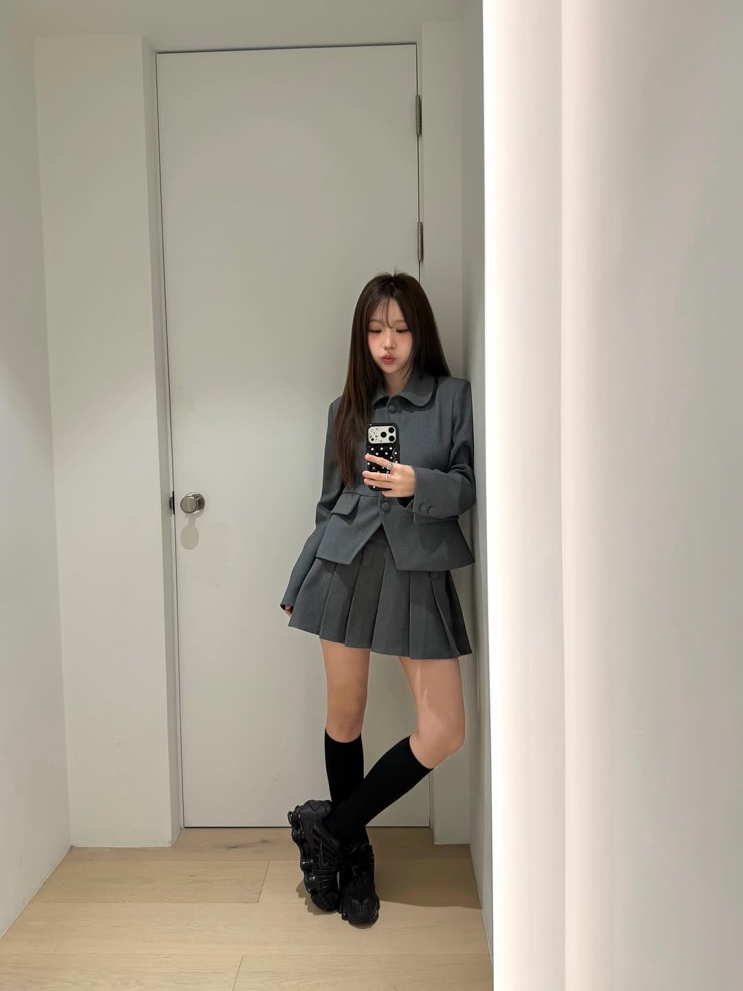 Photo by 합정미용실 모어온 송아인 on April 03, 2026. May be an image of duffle coat, overcoat, boots, miniskirt and text.