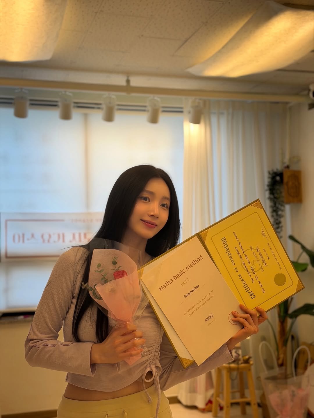 Photo by song han hee on March 15, 2026. May be an image of one or more people, braids, book, baby's-breath and text.