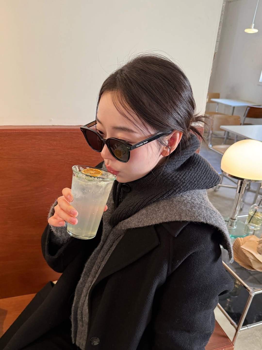 Photo by 송자영 SONG JA YOUNG on January 20, 2026. May be an image of duffle coat, eyewear, overcoat, lemonade, juice, cornflower and text.