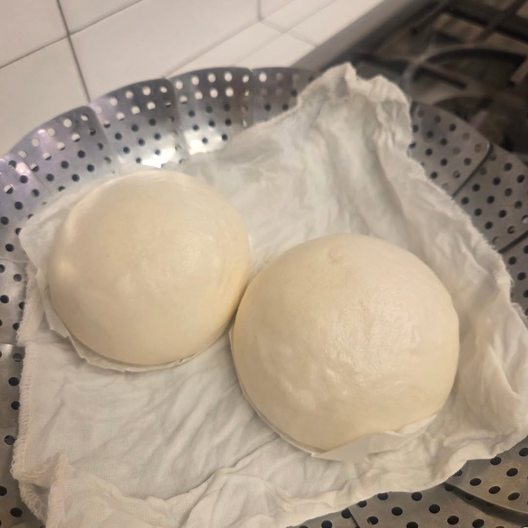 Photo by yoona on October 30, 2025. May be an image of dim sum, mozzarella, buns and text.