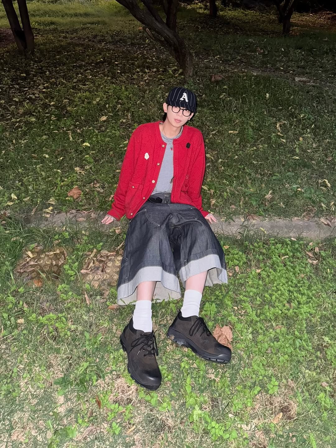 Photo shared by 소코년 sokonyun on October 12, 2025 tagging @yase_shoes, @grailz_official, @murra_aer, @koinseoul, and @aaoa_world. May be an image of duffle coat, cloak, beret, bandanna, kilt, outdoors and text.