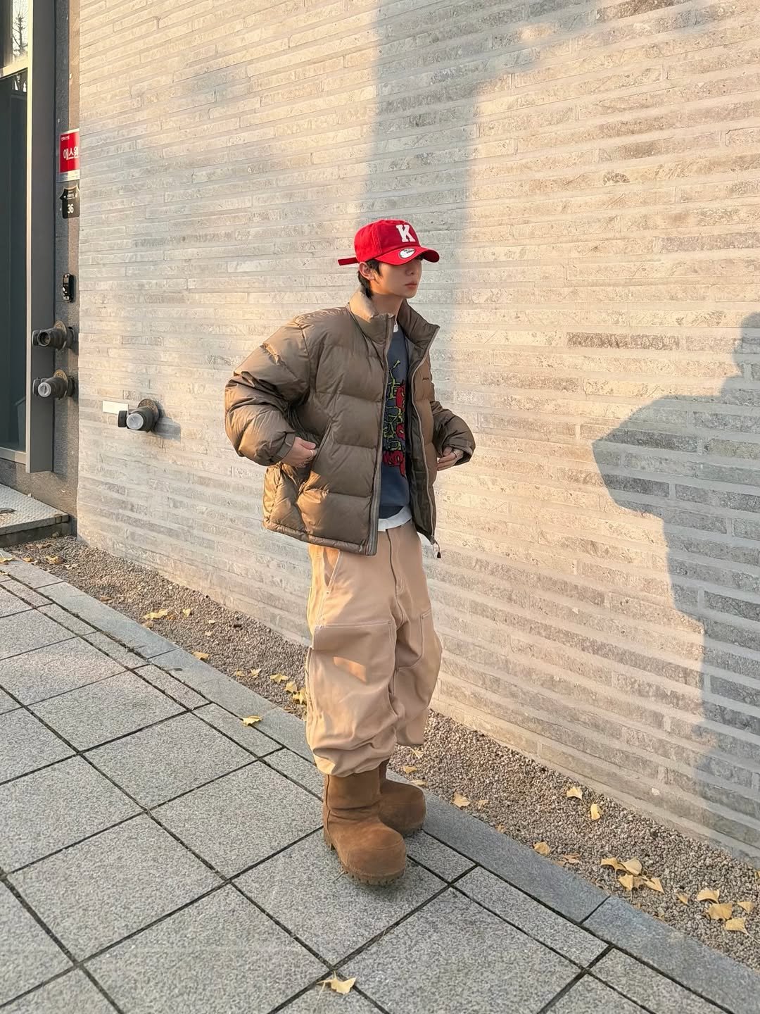 Photo shared by 소코년 sokonyun on November 26, 2025 tagging @balenciaga, @yeseyesee_official, @kamien.kr, @koinseoul, and @trendspace.kr. May be an image of duffle coat, goosedown coat, hat and overcoat.