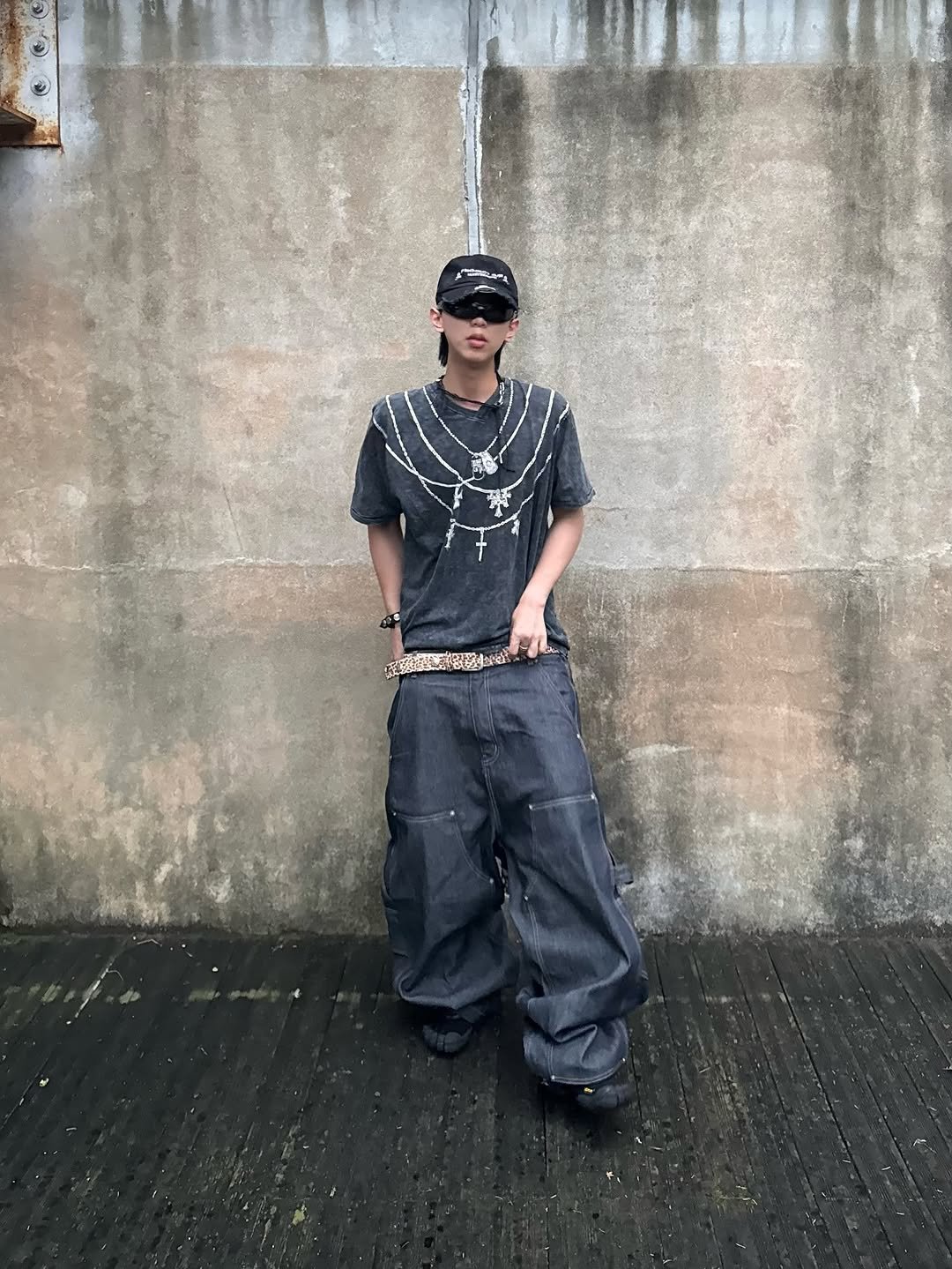 Photo shared by 소코년 sokonyun on August 18, 2025 tagging @nubian_tokyo, @mastermindjapan_official, @_breath_official, @grailz_official, and @koinseoul. May be an image of 1 person, glasses, bandanna, sweatpants and text.