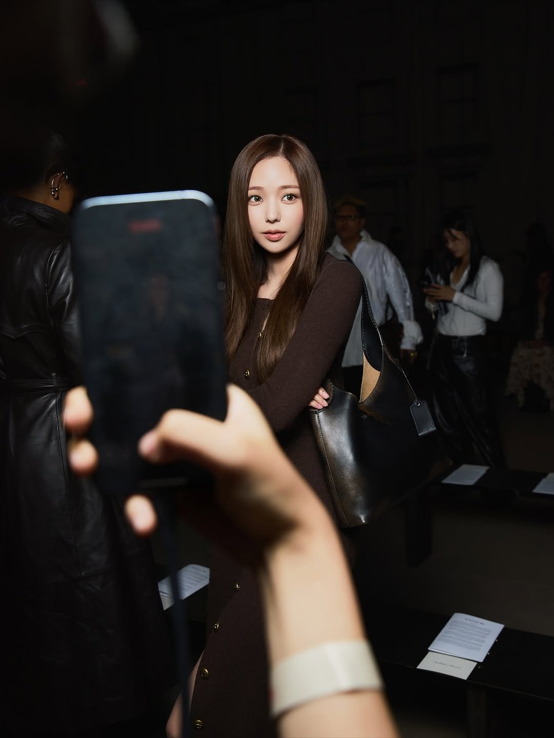 Photo shared by 채수빈 on September 18, 2025 tagging @coach. May be an image of 3 people, hair, phone, camera and text.