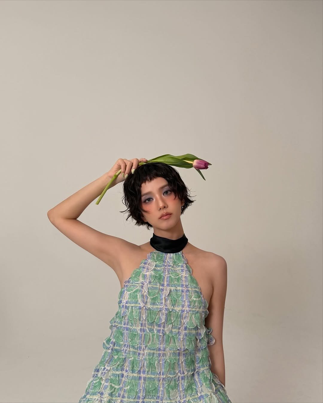 Photo shared by JISOO🪐 on November 24, 2025 tagging @dior, and @jonathan.anderson. May be an image of dress and text.