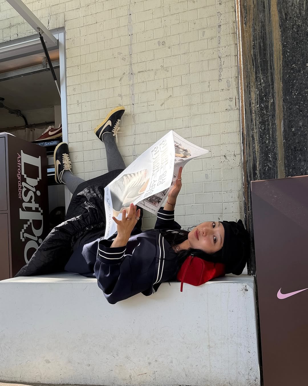 Photo shared by soso🫧 Kim dayoung on October 23, 2025 tagging @29cm.official, and @nikeseoul. May be an image of newspaper, book, curb and text.