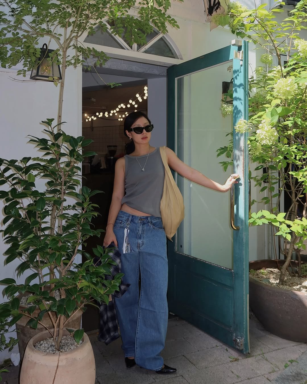 Photo shared by soso🫧 Kim dayoung on September 05, 2025 tagging @levis_korea. May be an image of 1 person, eyewear and cornflower.
