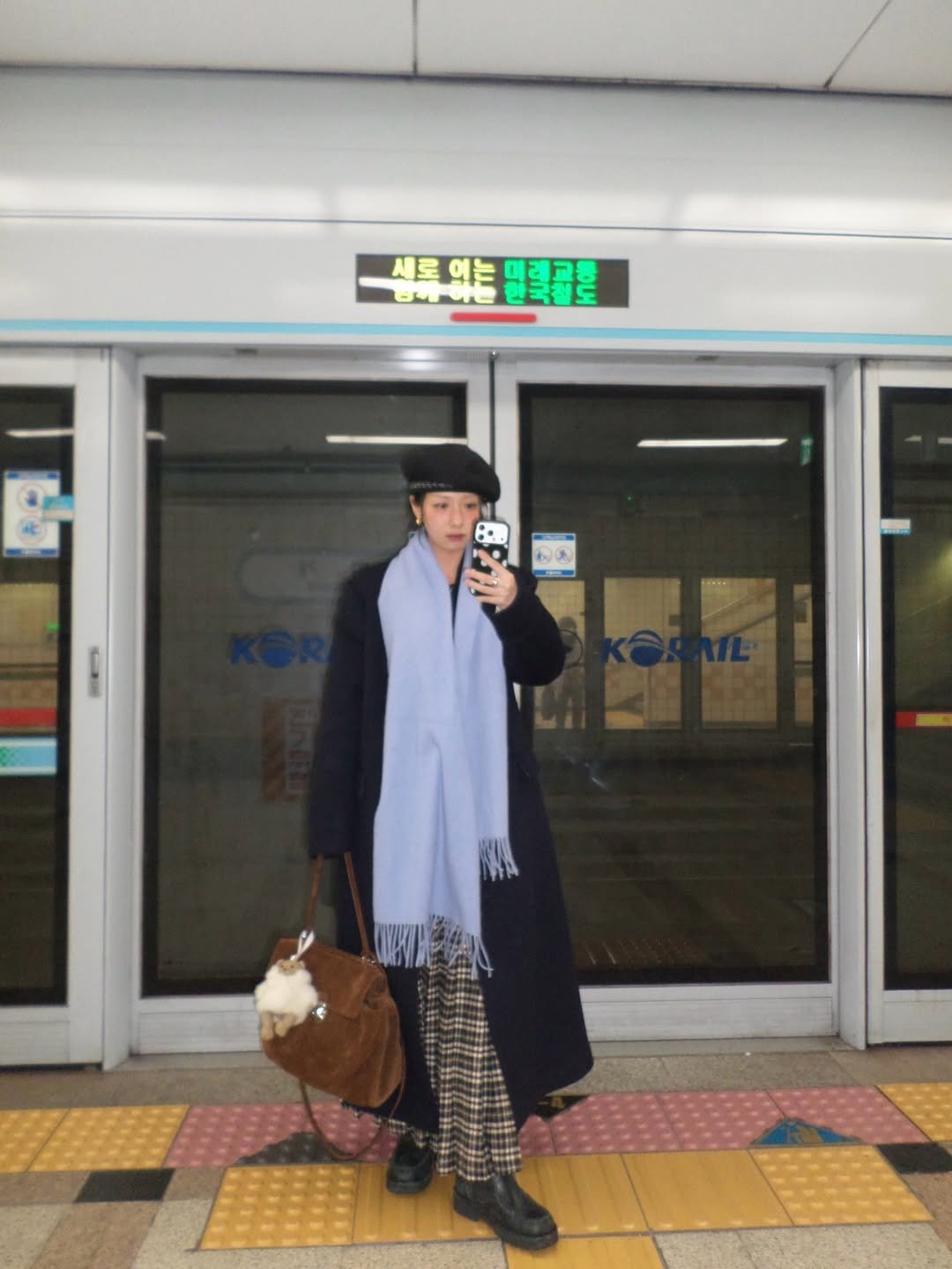 Photo shared by soso🫧 Kim dayoung on December 31, 2025 tagging @brownhat_official, @oursaalty, @ribbonbit.co, and @vanrohe.official. May be an image of train, overcoat, duffle coat, bath robe, parka and text.