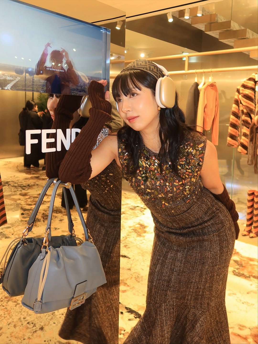 Photo shared by soso🫧 Kim dayoung on November 05, 2025 tagging @fendi, and @gnabnahc. May be an image of purse, display case and text.