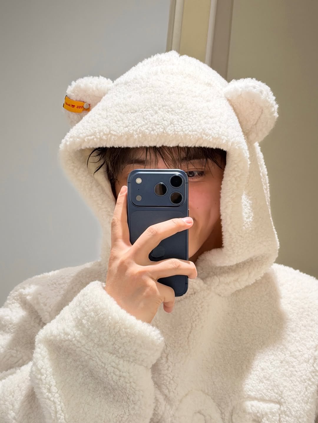 Photo shared by COUPS on February 25, 2026 tagging @boss. May be an image of bear, duffle coat, bath robe, parka, costume, fleece and text.