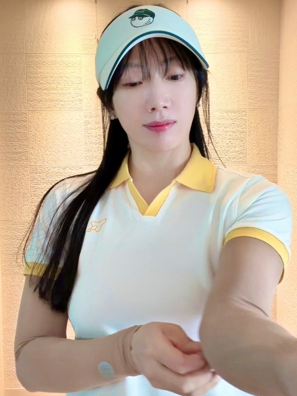 Photo by emilykim0415 on April 22, 2026. May be an image of one or more people, hair, people golfing, hat, top and text.