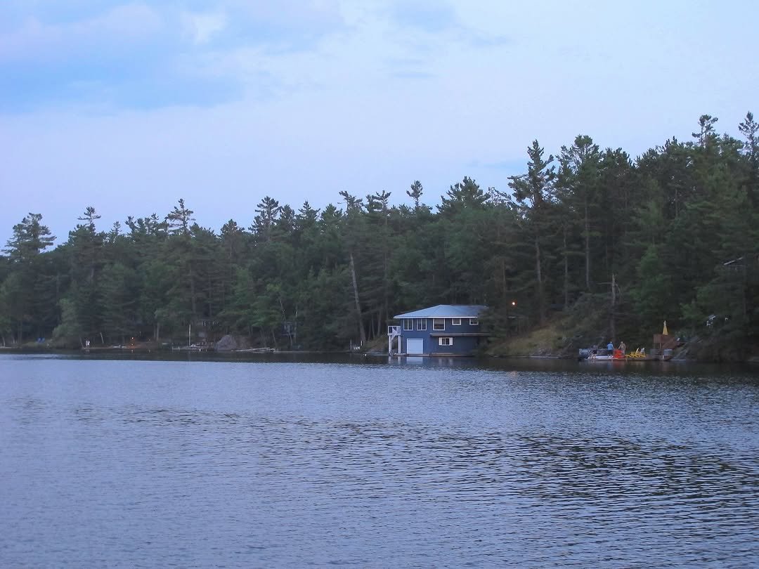 Photo by 세림 SERIM on November 02, 2025. May be an image of boat, twilight, lake, houseboat, boathouse and text.