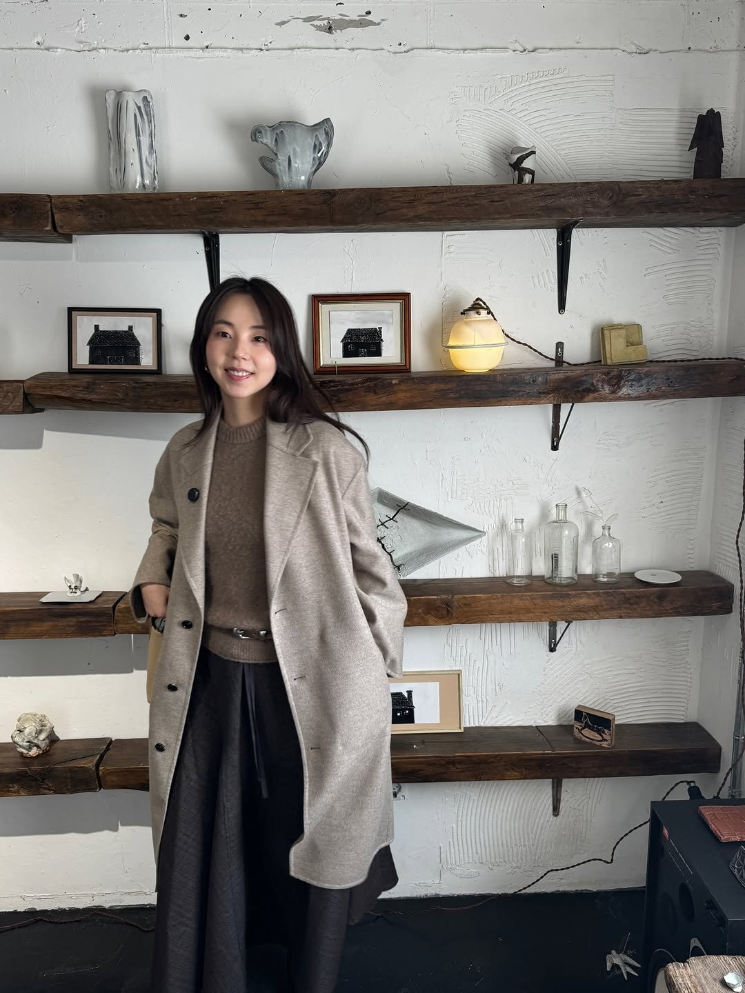 Photo shared by 안소희 on November 21, 2025 tagging @ourlegacy, @acnestudios, and @ojacraft. May be an image of duffle coat, overcoat and text.