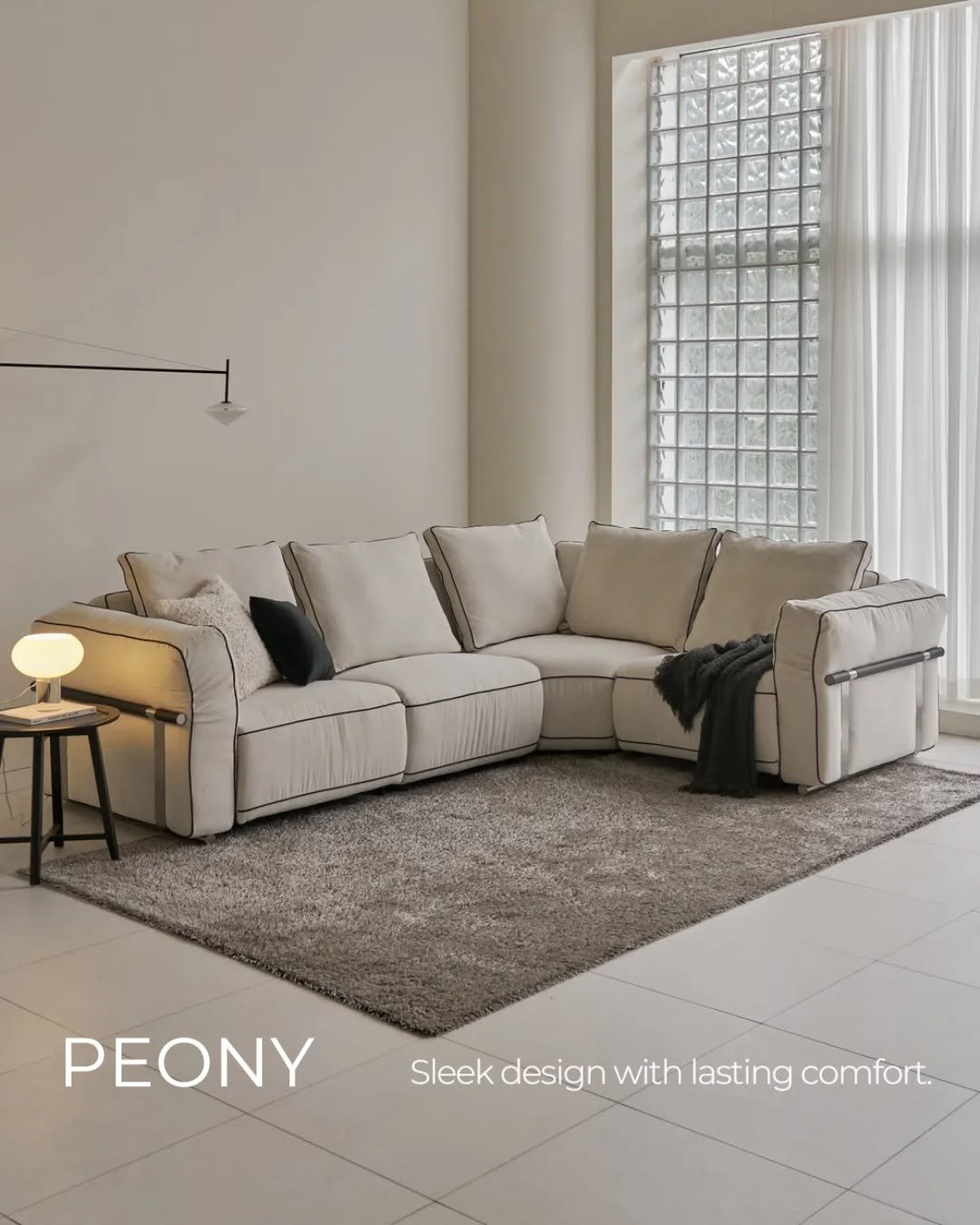 Photo by 🛋️ 썸앤데코 OFFICIAL on September 26, 2025. May be an image of sofa, armchair, living room, indoors and text that says 'PEONY Sleek design with lasting comfort.'.