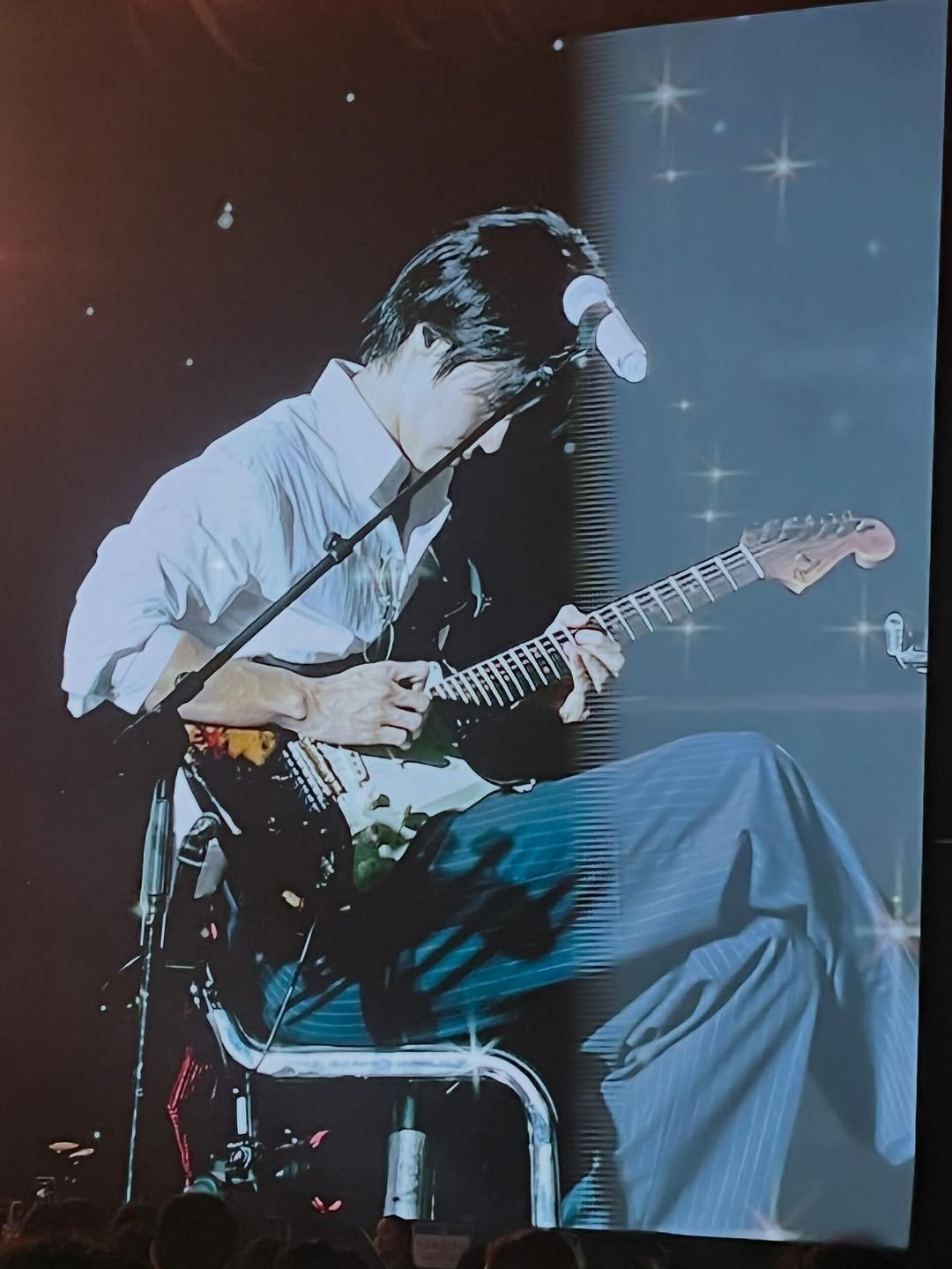 Photo by 이승협 on December 22, 2025. May be an image of guitar, concert and text.