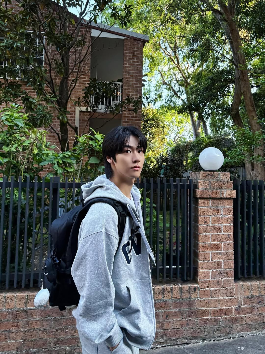 Photo shared by 이승협 on October 15, 2025 tagging @covernat_. May be an image of duffle coat, parka, outdoors and text.