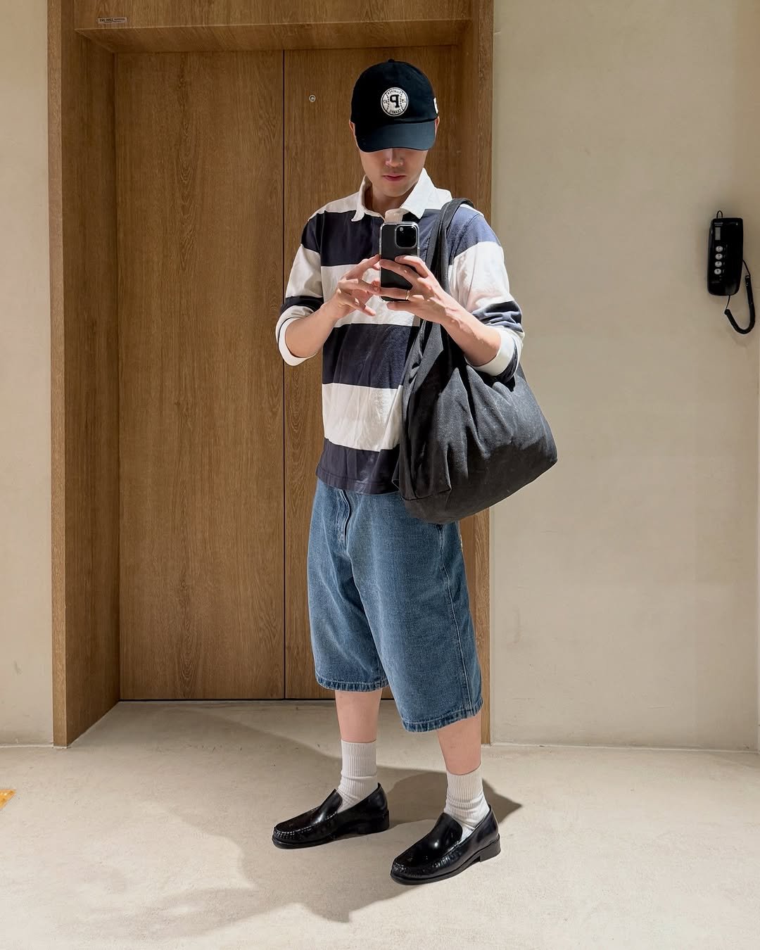 Photo shared by Euisun Sim 심의선 on September 09, 2025 tagging @acnestudios, @jw_anderson, @poloralphlauren, and @passer_office. May be an image of 1 person, duffle coat, hat, sweatpants and text.