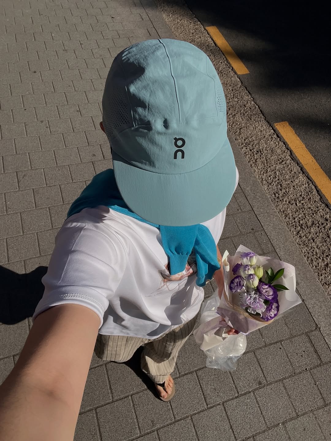 Photo shared by Euisun Sim 심의선 on July 10, 2025 tagging @on, and @stu_office. May be an image of 1 person, hat, plastic bag and text.