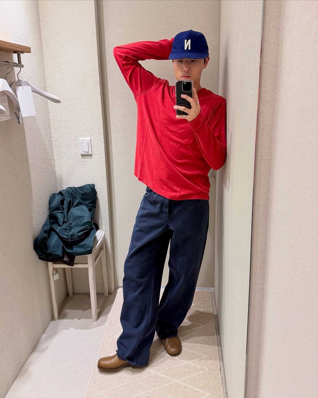 Photo shared by Euisun Sim 심의선 on September 01, 2025 tagging @afterpray_official. May be an image of 1 person, hat, duffle coat, sweater, sweatpants and text.