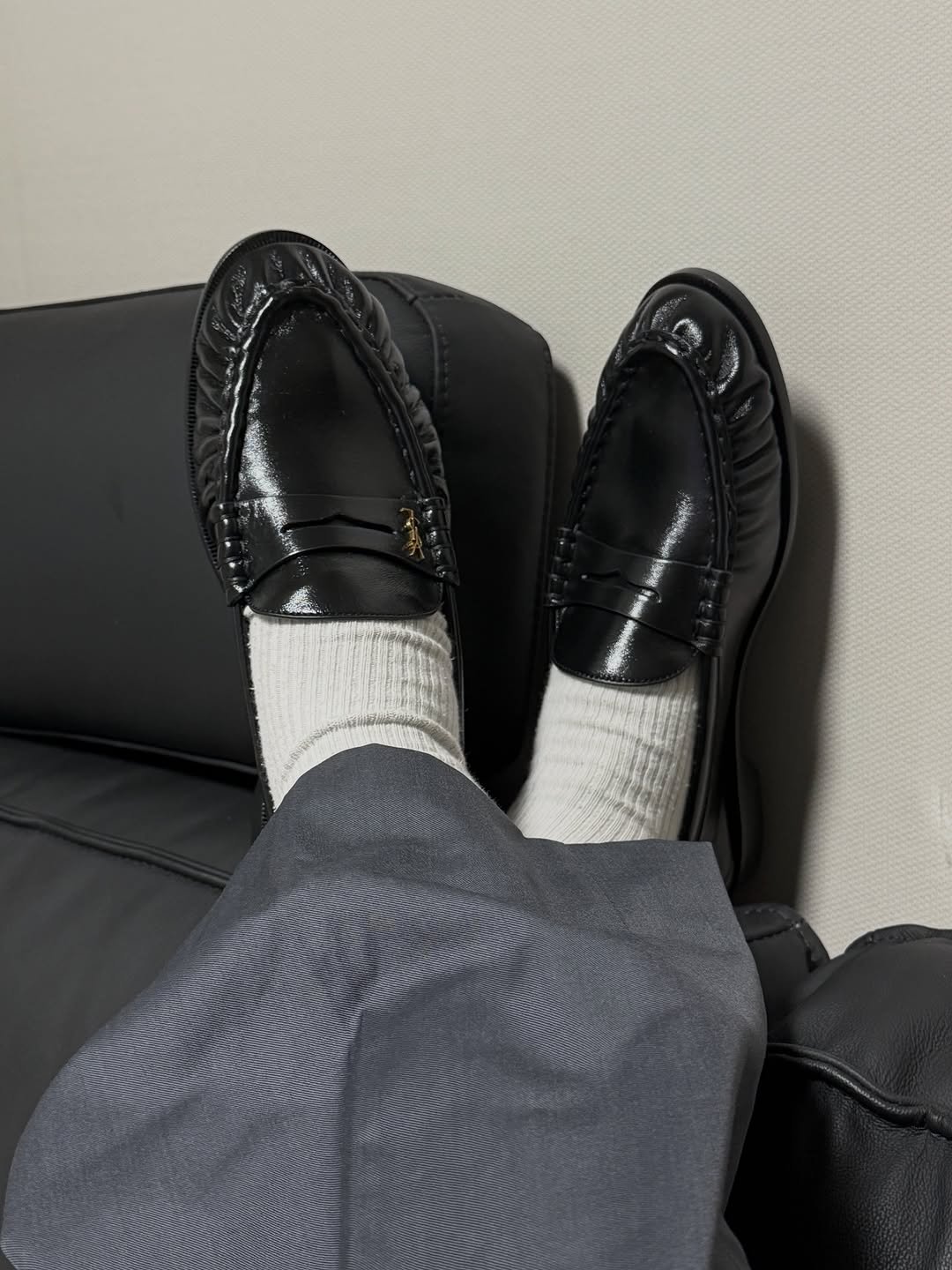 Photo shared by Euisun Sim 심의선 on September 26, 2025 tagging @ysl. May be an image of wingtip shoes, loafer, sock and text.
