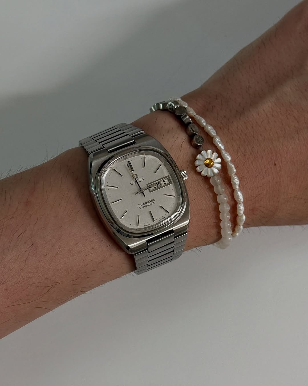 Photo shared by Euisun Sim 심의선 on August 05, 2025 tagging @omega. May be an image of jewelry, wrist watch, bangle and text.