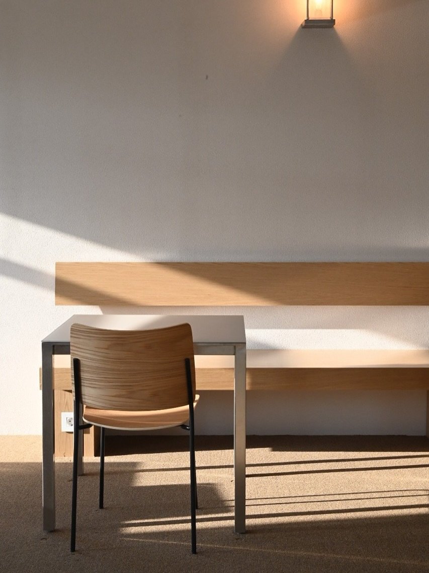 Photo shared by studio peas on August 31, 2025 tagging @kredshaus. May be an image of table, lighting, armchair and dining table.