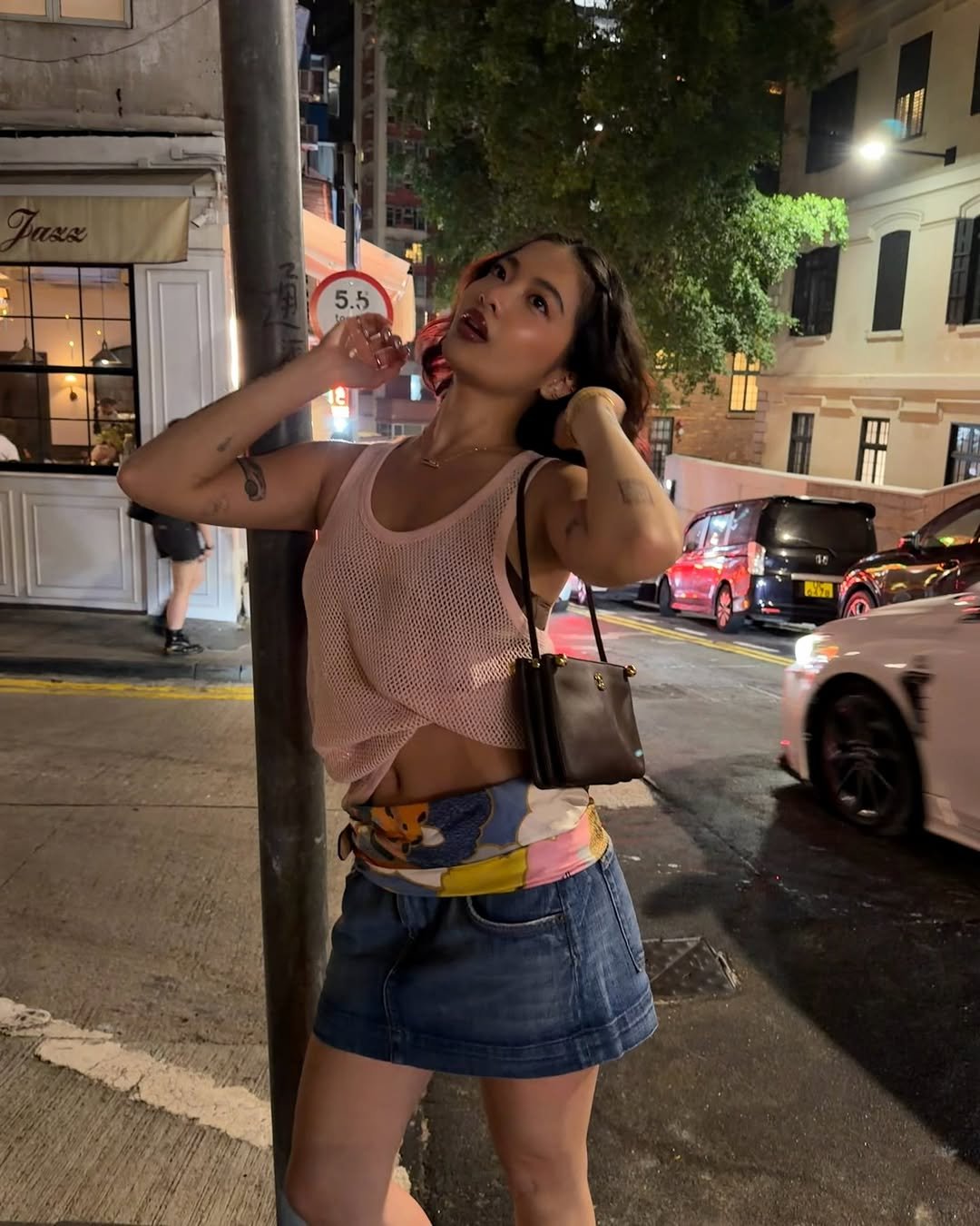 Photo by steph hui on April 03, 2026. May be an image of fishnet stockings, shorts, miniskirt and text.