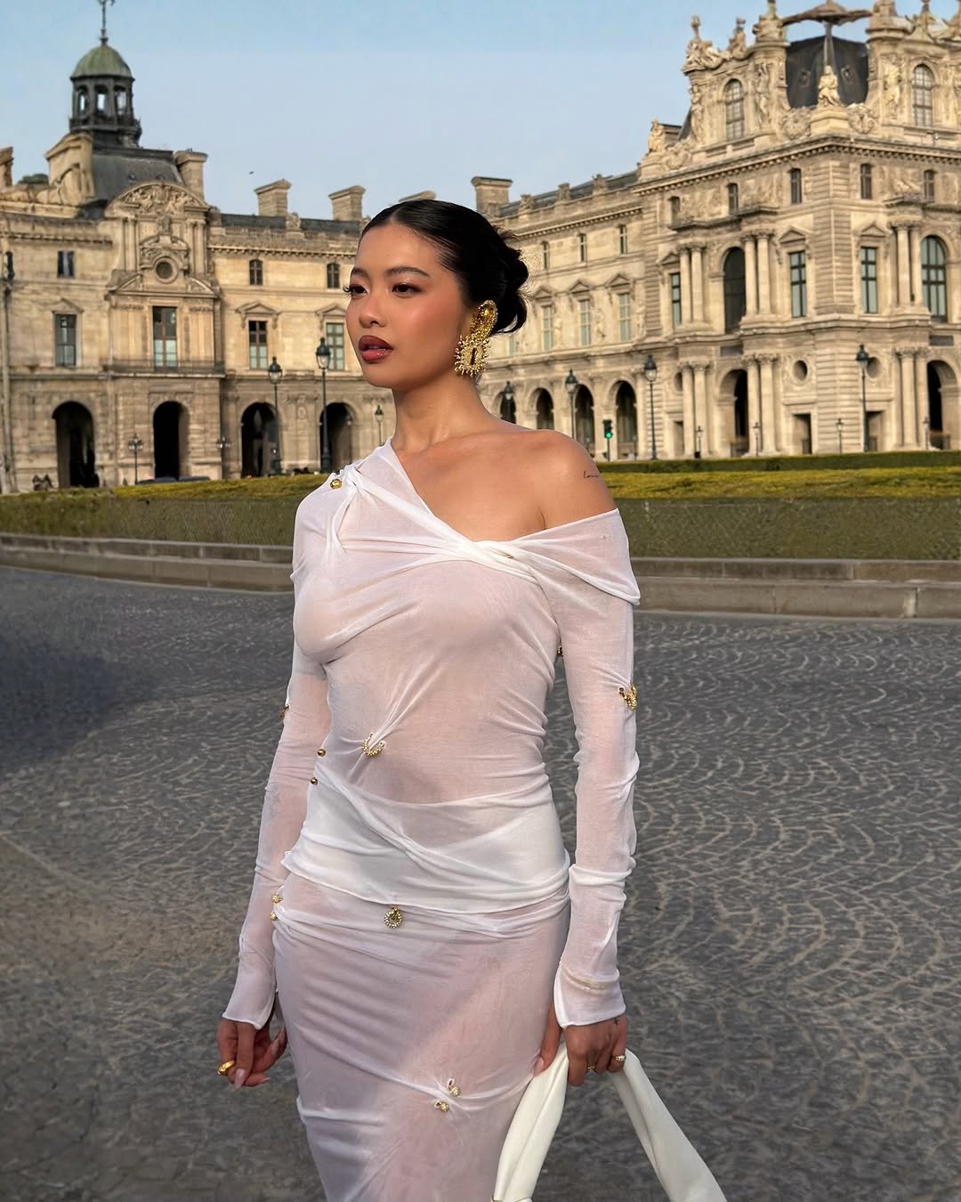 Photo shared by steph hui on March 07, 2026 tagging @schiaparelli. May be an image of gown, dress and text.