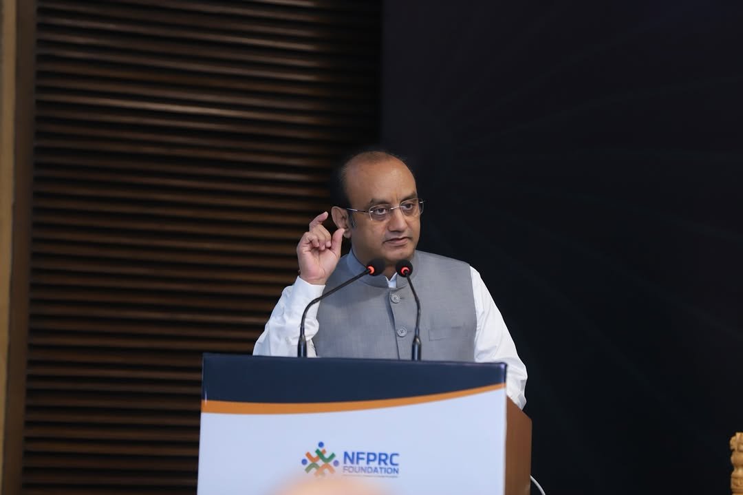 Photo by Dr Sudhanshu Trivedi on April 27, 2026. May be an image of microphone, dais, newsroom and text that says 'NFPRC FOUNDATION'.