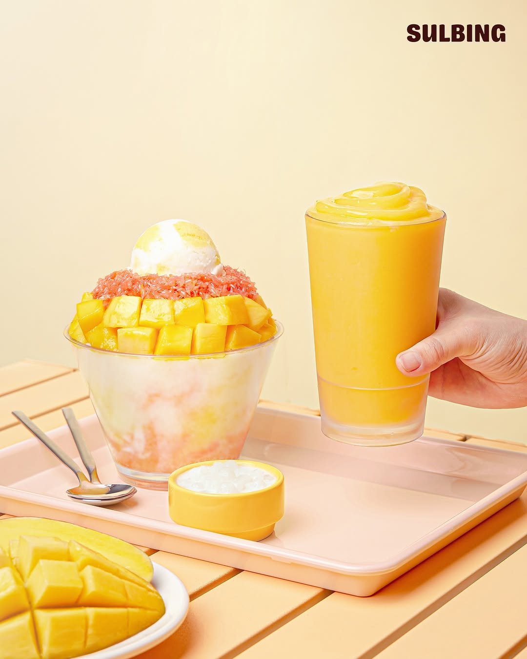 Photo by 설빙 on August 13, 2025. May be an image of gelato, juice, smoothie, mango, wafer, fruit cocktail and text that says 'SULBING'.