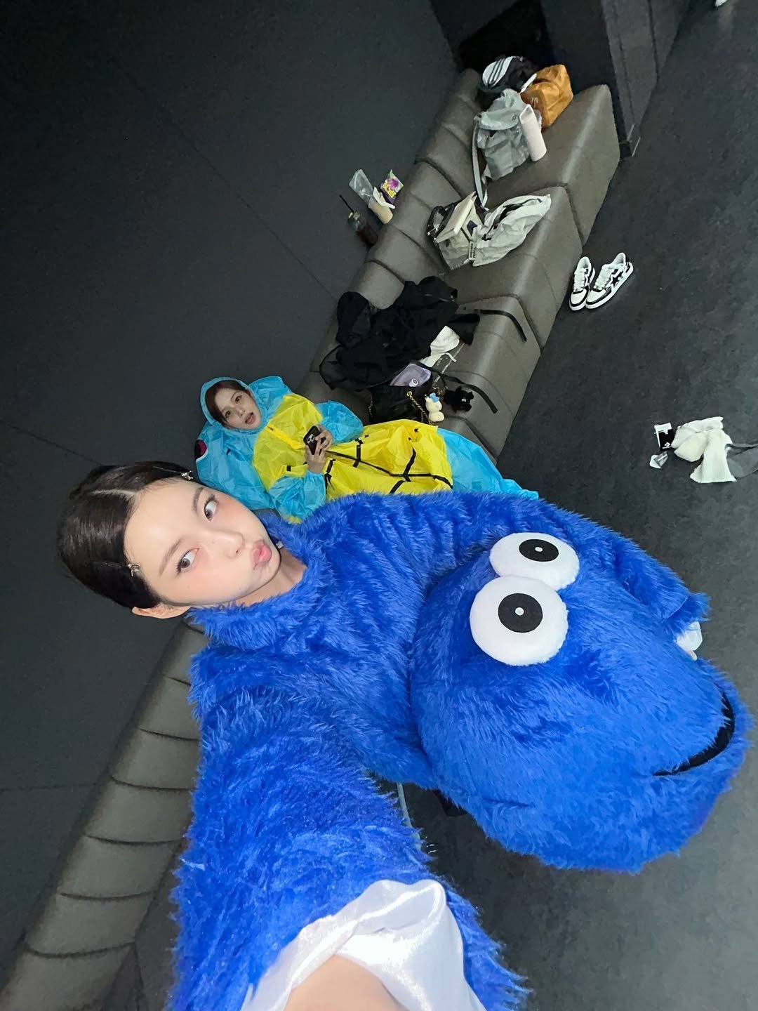 Photo shared by NMIXX KYUJIN (장규진) on February 23, 2026 tagging @nmixx_official, and @sullyoon_nmixx. May be an image of costume, bath robe and text.